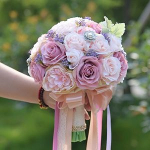 Quinceanera flower bouquet, a person holding a bouquet of flowers in their hand