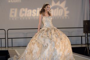 Quinceanera gown, a woman in a dress on a runway