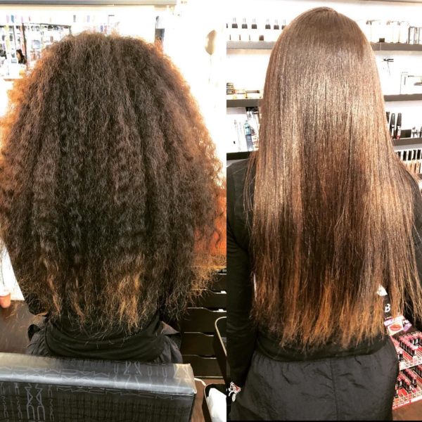 Quinceanera image: Two women sitting in front of a hair salon, showcasing a stunning long hair hairstyle