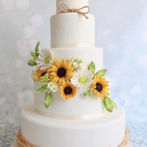 Quinceanera cake, a three-tiered cake with sunflowers on top