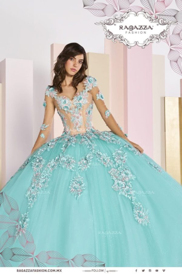 A beautiful woman in a shades of blue Quinceanera dress, standing in a ball gown