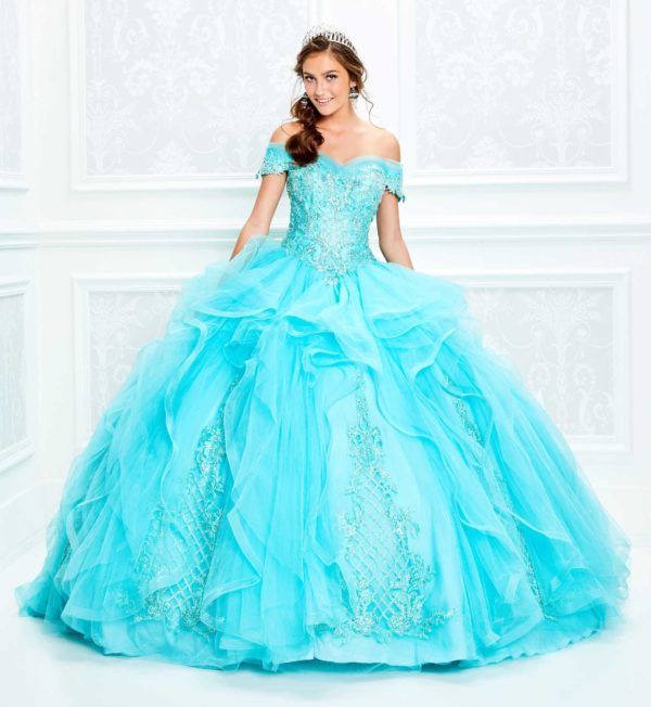 A woman posing for a picture in a blue Quinceañera gown dress creation