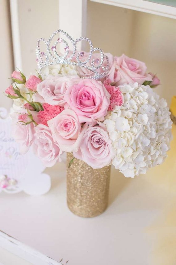 Quinceanera image: A beautiful floral arrangement of pink and white flowers in a vase, inspired by Disney princesses.