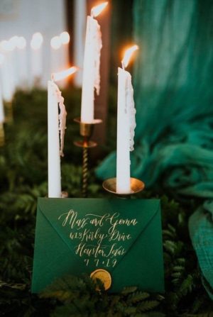 Quinceanera Invitation, a table with candles and a green envelope