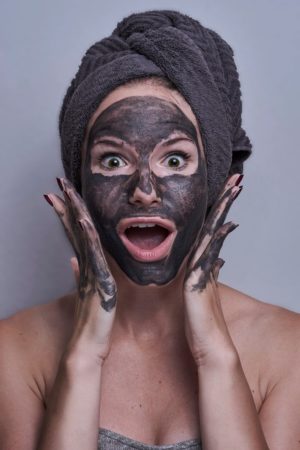 Woman using a face mask