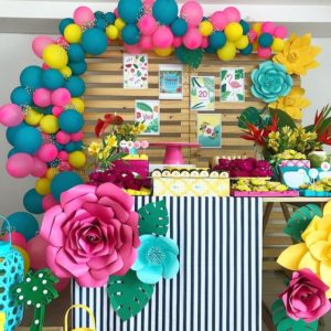 Floral design with flamenco decoration and lots of colorful paper flowers on a table
