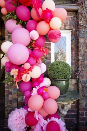 Quinceanera image of a bunch of balloons on a pole