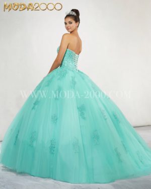 A woman in a green ball gown for a Quinceanera.