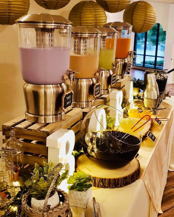 An unforgettable Quinceanera brunch with a buffet table adorned with a variety of drinks
