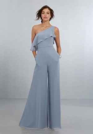 Quinceanera image: A woman in a blue jumpsuit standing in front of a white background wearing a Bridesmaid Dress