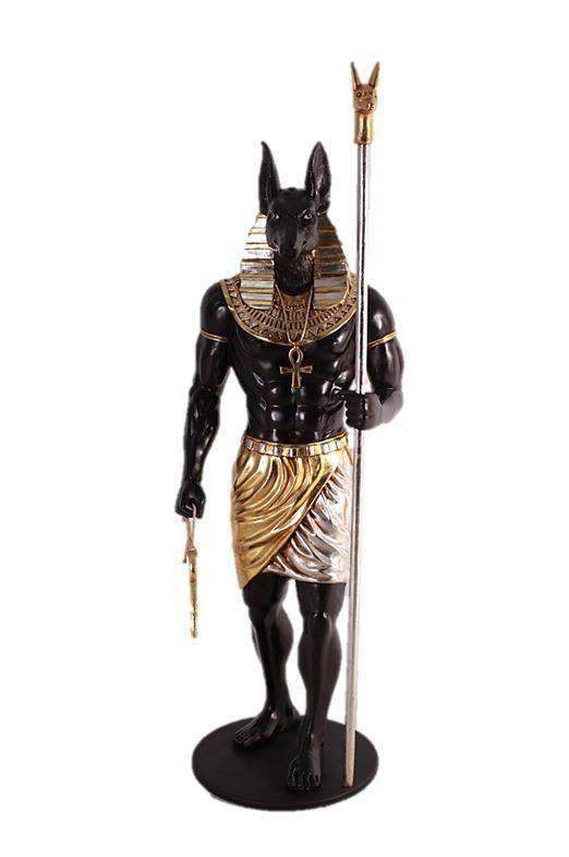 A statue of the Egyptian god Anubis holding a staff, located in l'auditori, Quinceanera theme