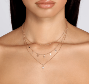 Close up of a woman wearing a Quinceanera necklace
