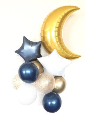 A Quinceanera-themed image featuring a bunch of balloons with a crescent and stars, along with body jewelry.
