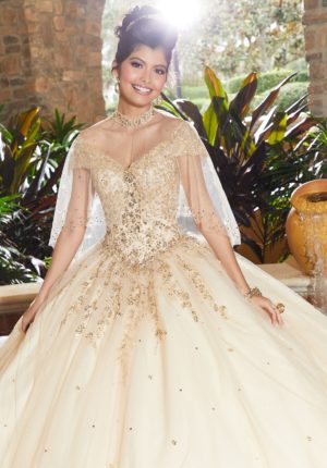A woman in a ball gown posing for a picture wearing morilee 60091 Quinceañera dress