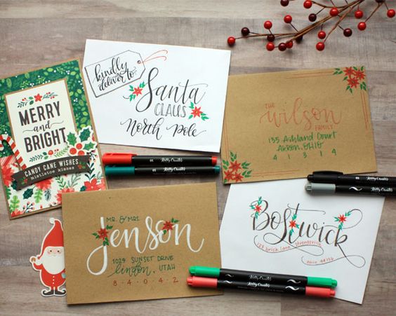 A group of Quinceanera-themed Christmas cards enveloped with art markers.