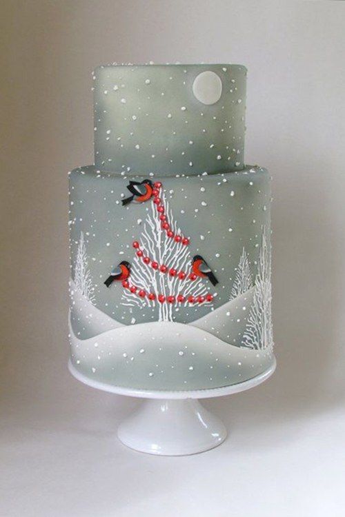 A three-tiered Quinceanera cake with airbrushed designs and birds on it.