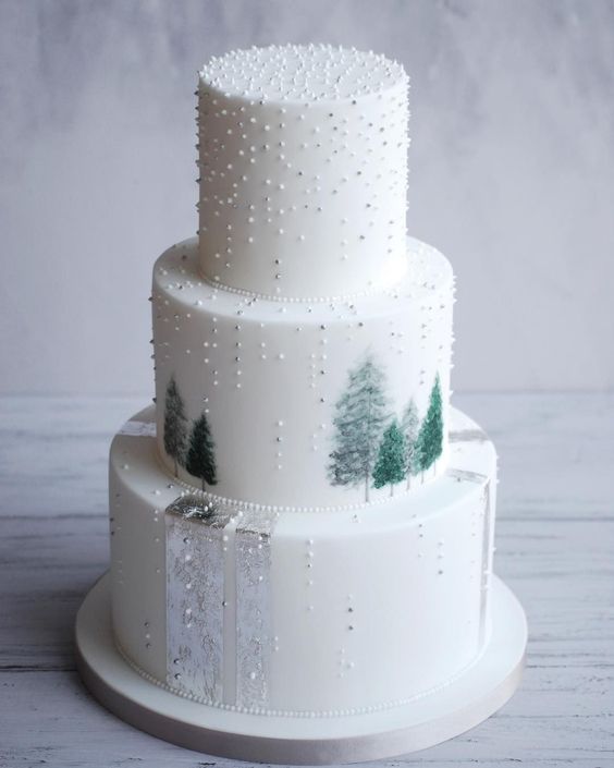 A Quinceanera cake with three tiers, decorated with trees