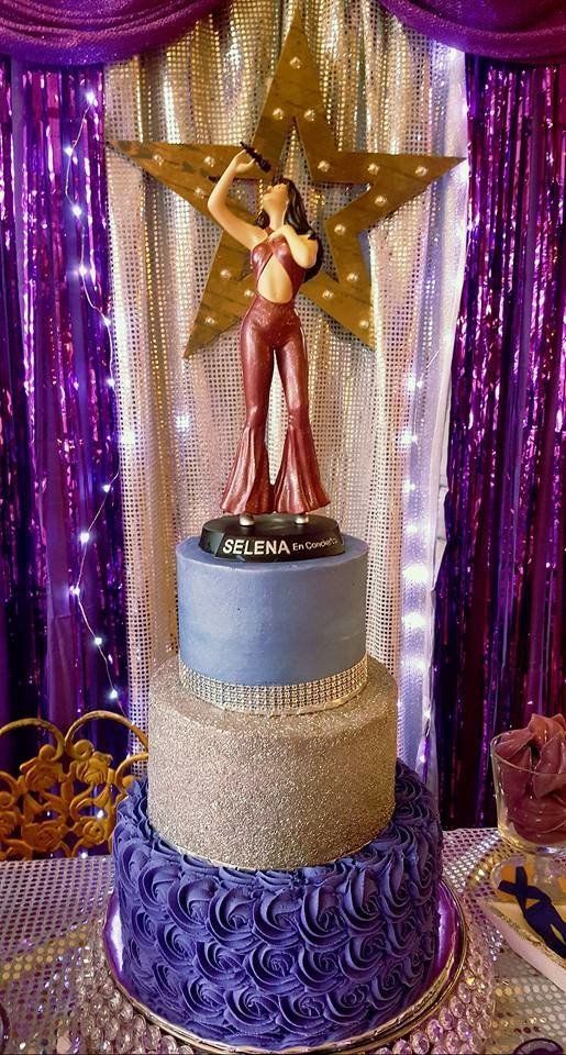 A Quinceanera celebration featuring Selena Quintanilla themed dresses and a cake with a woman on top of it.