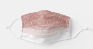 A Quinceanera fashion accessory party with a pink and white face mask on a white surface