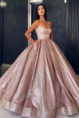Quinceanera themes rose gold Quinceañera dresses, a woman in a pink gown posing for a picture