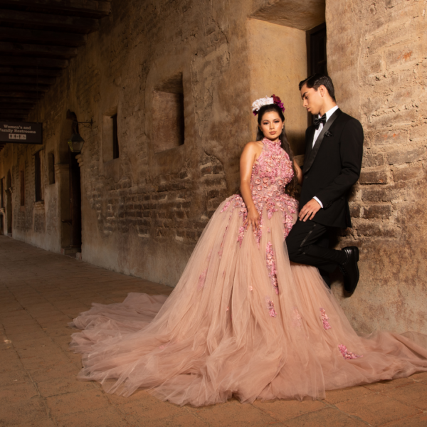 A man in a tuxedo and a woman in a Quinceanera gown