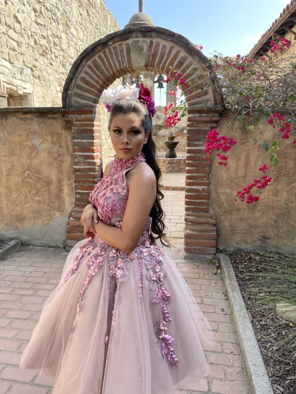 Mission San Juan Capistrano, Landmark, Chapel, Museum and Gardens, a woman wearing a pink dress standing in front of a brick wall