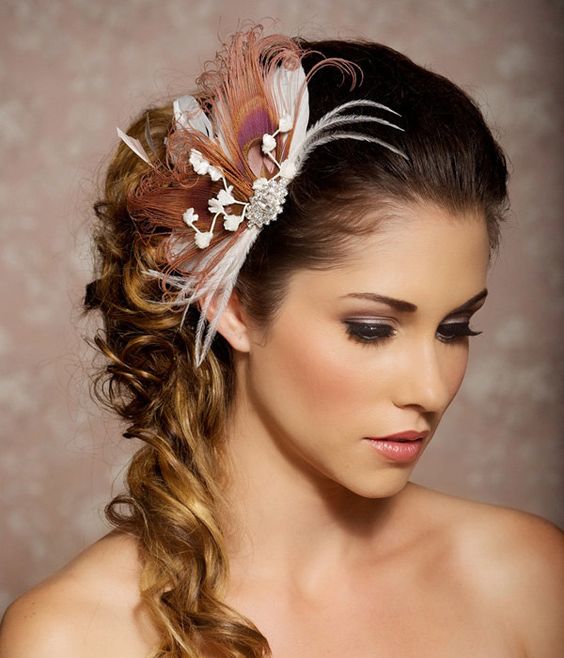 A woman with a flower in her hair wearing a cobalt blue T-shirt for a Quinceanera celebration.