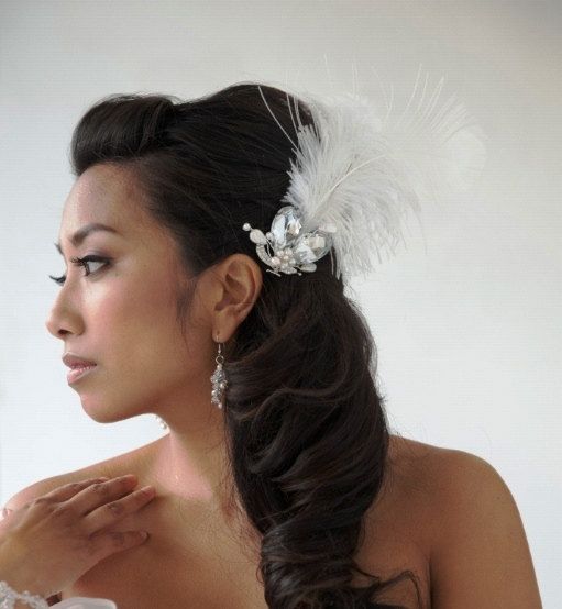 Cobalt blue woman in a Quinceanera dress with a flower in her hair