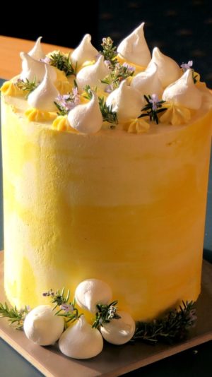 Quinceanera: A close up of a red velvet cake and a yellow cake on a plate