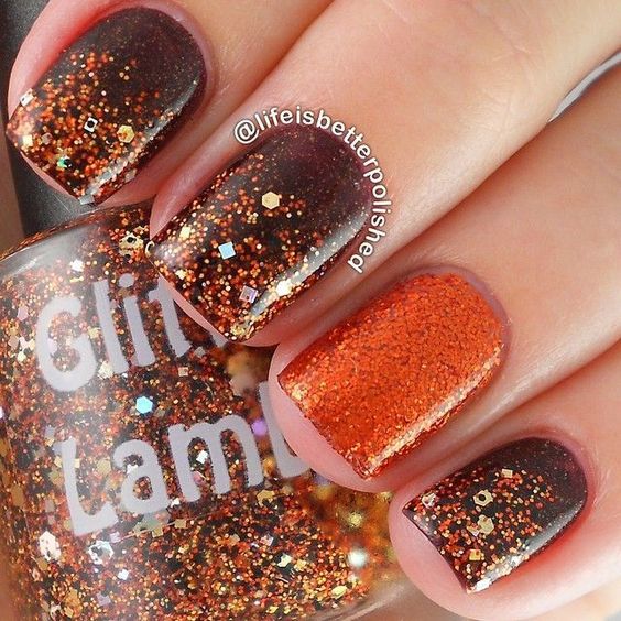 Quinceanera themed image featuring a person holding a bottle of nail polish and showcasing a glitter fall nail art design.