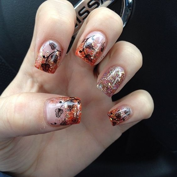 A manicured hand with a design on the nails for a Quinceanera
