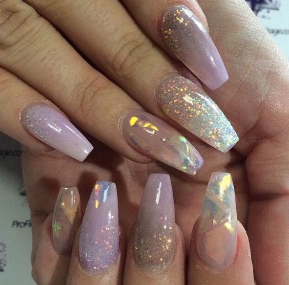 Quinceanera image: a person holding a pink and silver manicure with acrylic nails in a tornasol lila design