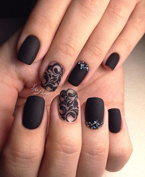 Quinceanera-themed image featuring a person holding a black and white manicure with a black lace short nails design