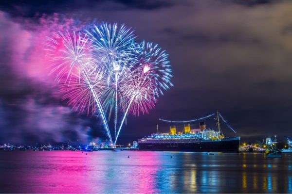 The Queen Mary ship in the water with fireworks in the sky, Quinceanera