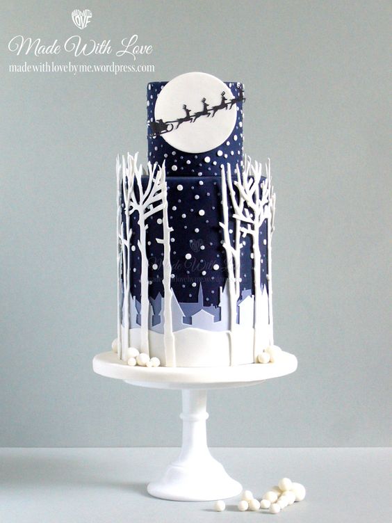 A silhouette Quinceanera cake, featuring a white cake adorned with flowers and greenery, displayed on a table