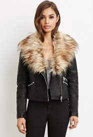A woman wearing a black leather jacket with a fur collar, perfect for a Quinceanera event