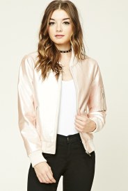 A Quinceanera fashion model wearing a pink leather jacket and black pants