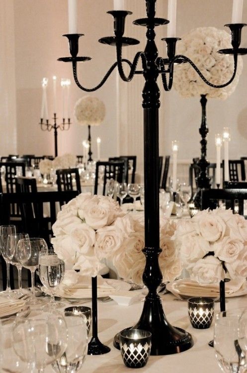 A classy Quinceanera DIY Wedding Invitation depicting a black candelab with white flowers and candles