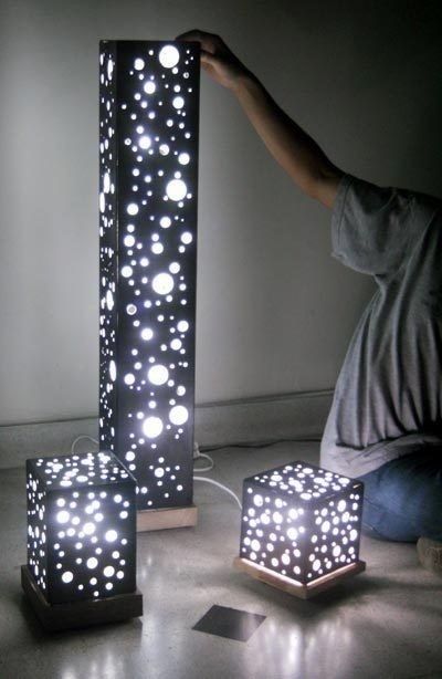 Quinceanera celebration with Christmas lights, featuring a person sitting on the floor next to a lamp