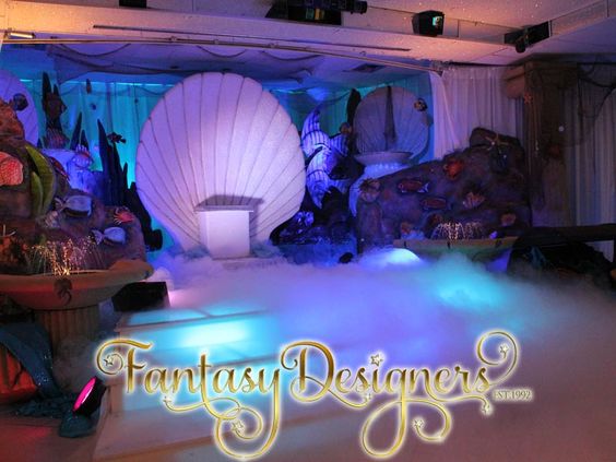 A photo of a stage set up for a Quinceanera party with function hall Quinceañera dresses