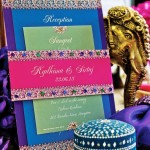 Quinceanera invitation card with purple and green napkins on a table
