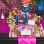 Quinceanera table decoracion mesa arabe: A table with a pink table cloth and a gold plate