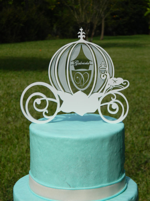 Quinceanera cake decorating, a blue cake with a white horse drawn carriage on top
