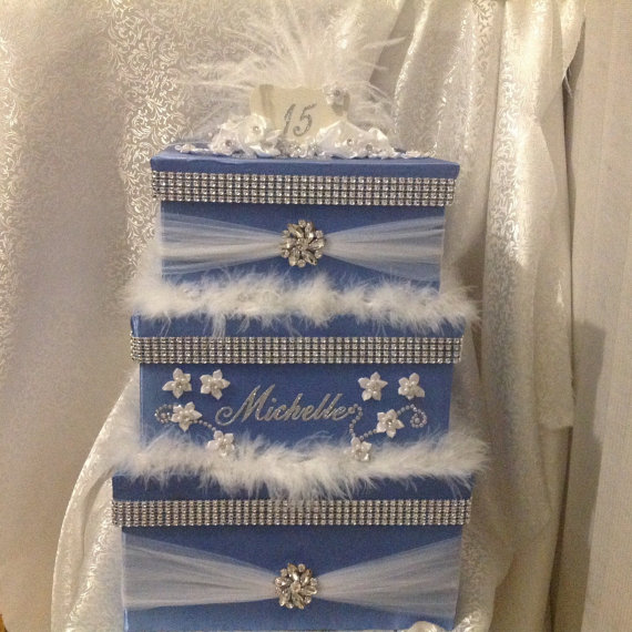 Quinceanera ceremony supply Wedding Invitation, a stack of three blue boxes with bows and snowflakes