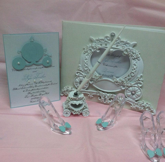 A table with a picture frame, a pair of shoes, and a glass Quinceañera decoration
