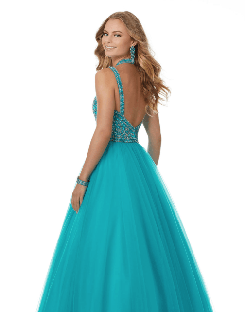 A woman in a turquoise ball gown for a Quinceanera