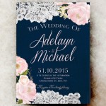 A Quinceanera floral design featuring cut flowers with roses and lace on a wedding invitation