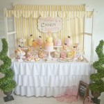 Quinceanera-themed interior design table with a variety of cakes and desserts
