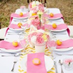 Quinceanera image of a table set with pink and yellow place settings for a bridal shower