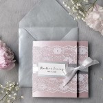 A close up of a Quinceanera invitation with flowers